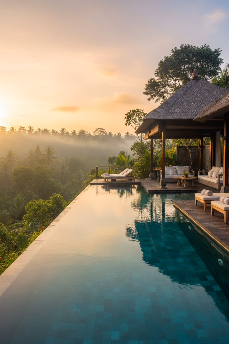 An infinity pool above the Balinese forest at dawn