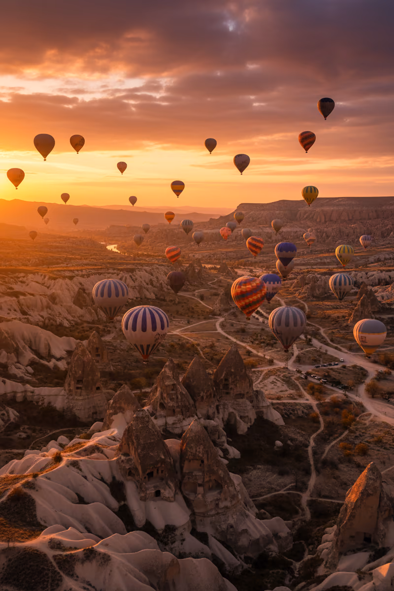 Balloons over the rock valleys of Cappadocia at sunrise