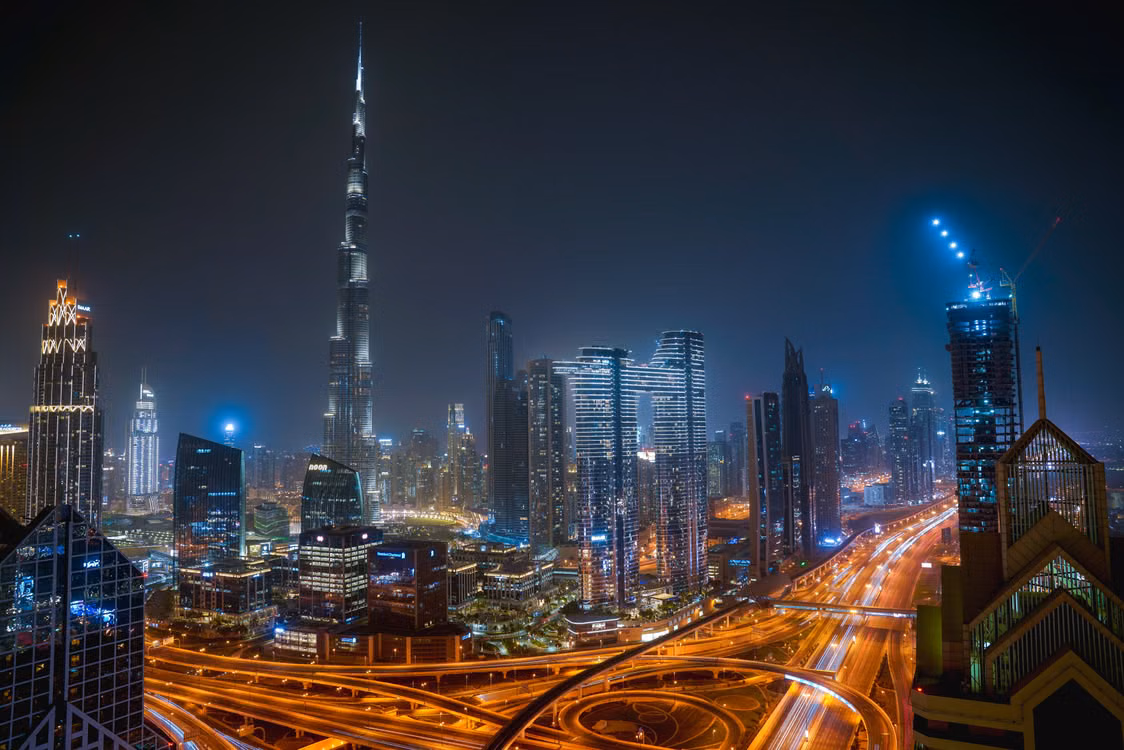 Dubai skyline and Burj Khalifa lit at night