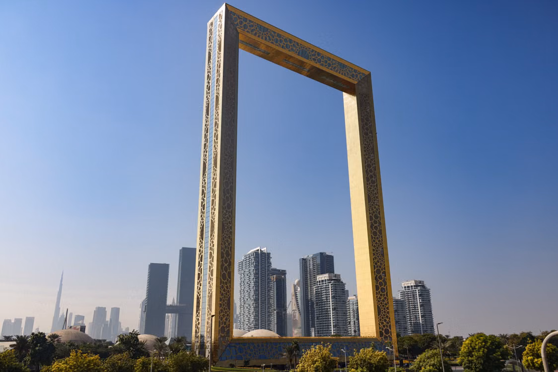 The golden Dubai Frame above the city