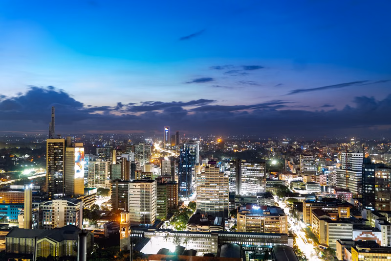 The Nairobi skyline lit at dusk