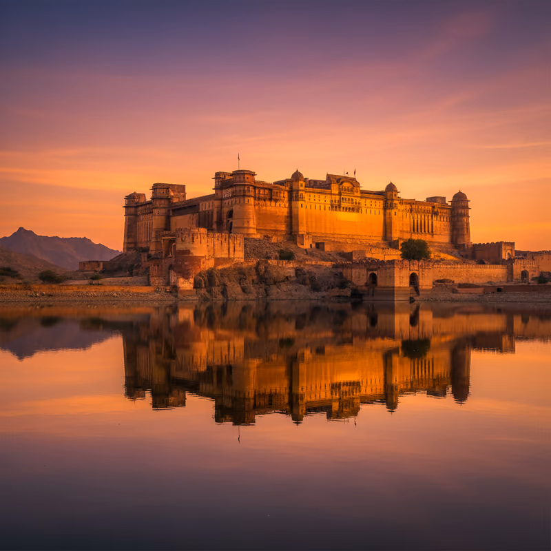 Amber Fort above its lake at sunset, Rajasthan