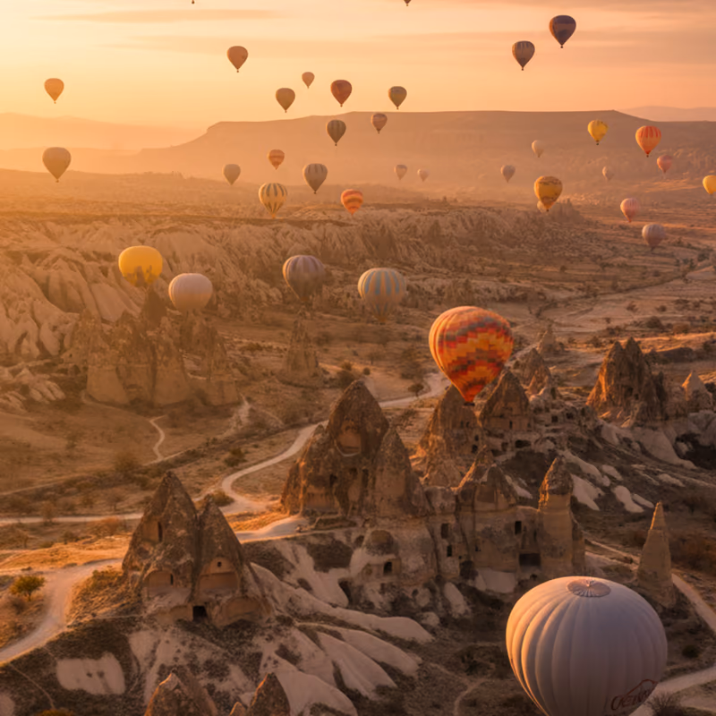 Balloons over the rock valleys of Cappadocia at sunrise