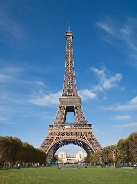 The Eiffel Tower rising over the Champ de Mars