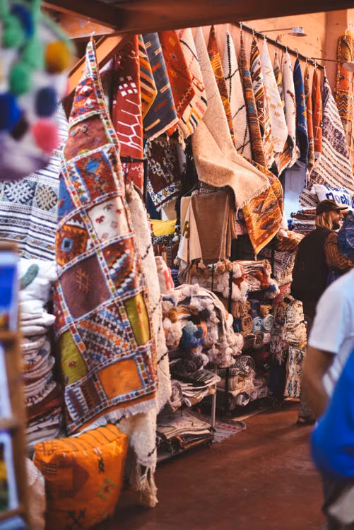 Rugs and textiles hanging in a covered market